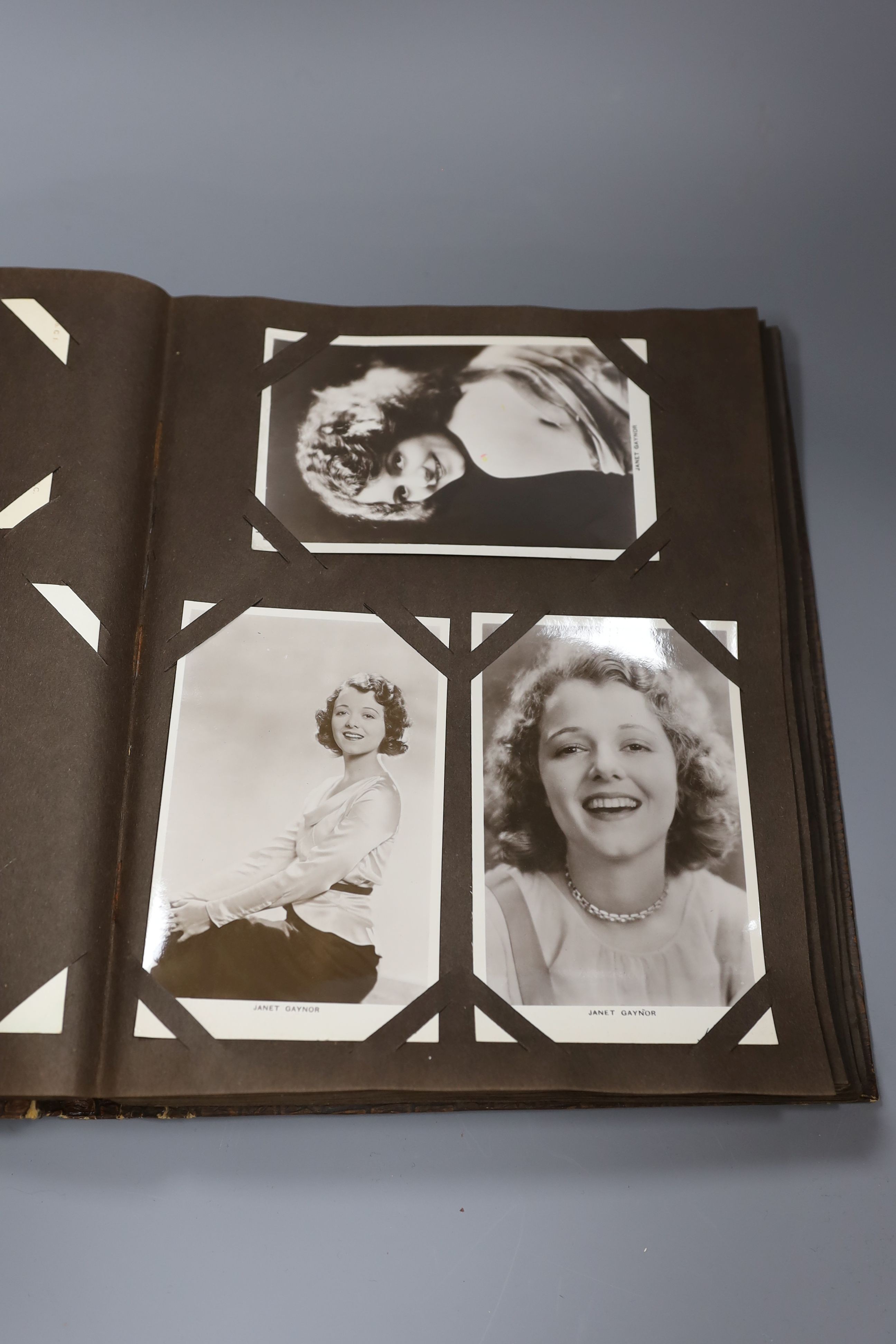 An album of approximately 160 early 20th century monochrome studio postcards including Garbo, Crosby, Gable and Hepburn.